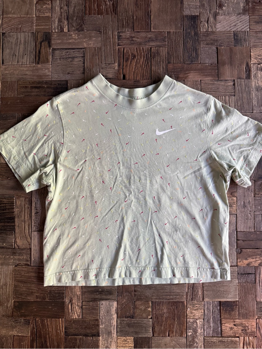 Nike Light Green Cropped Tee with Pink Mini Swoosh Pattern